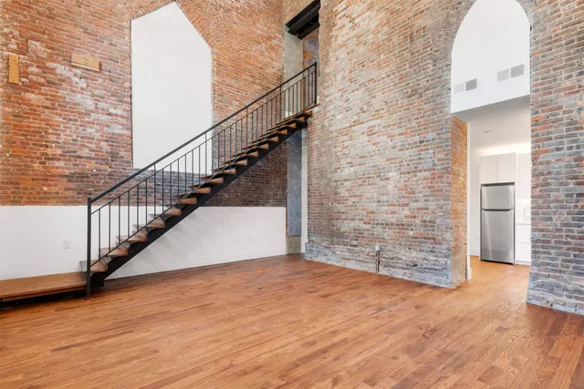 a view of entryway with wooden floor