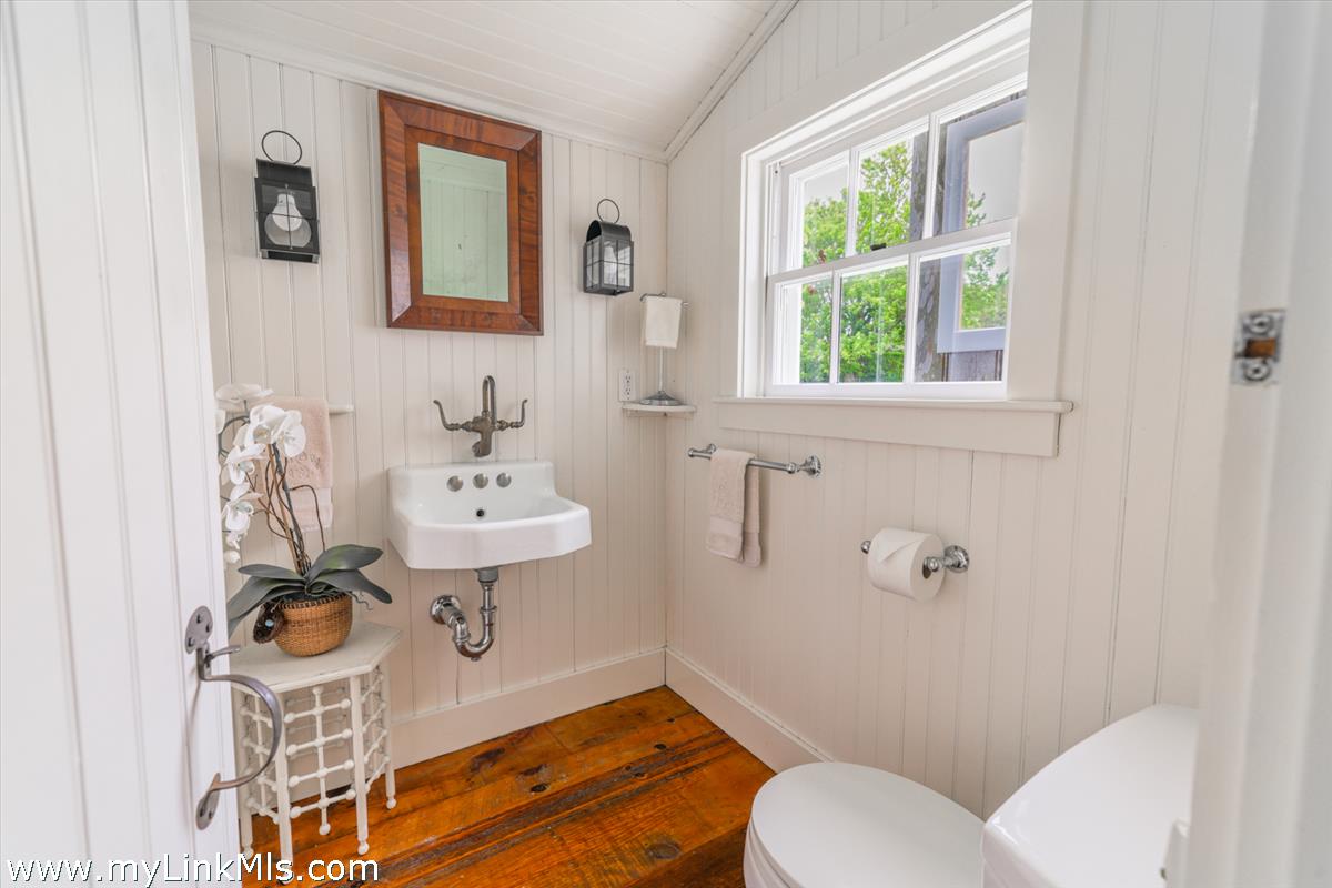 14 & 16 Coffin Street Nantucket, MA 02554 - Photo 33 of 50 a bathroom with a sink mirror bathtub and toilet