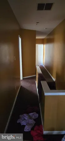 a bed sitting in a room next to a window