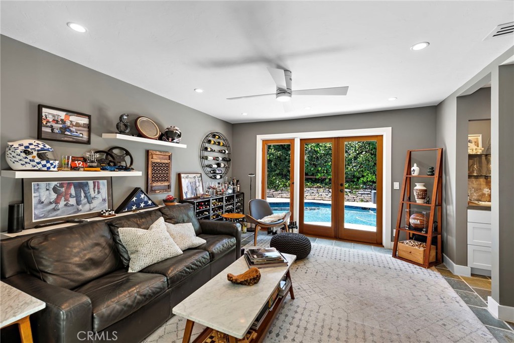 3085 Nestall Road Laguna Beach, CA 92651 - Photo 12 of 33 a living room with furniture and a flat screen tv