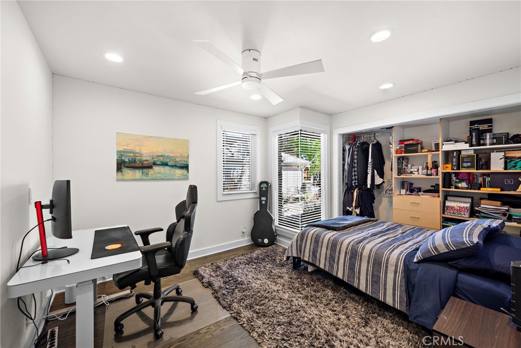 3085 Nestall Road Laguna Beach, CA 92651 - Photo 19 of 33 a bedroom with furniture and a wooden floor