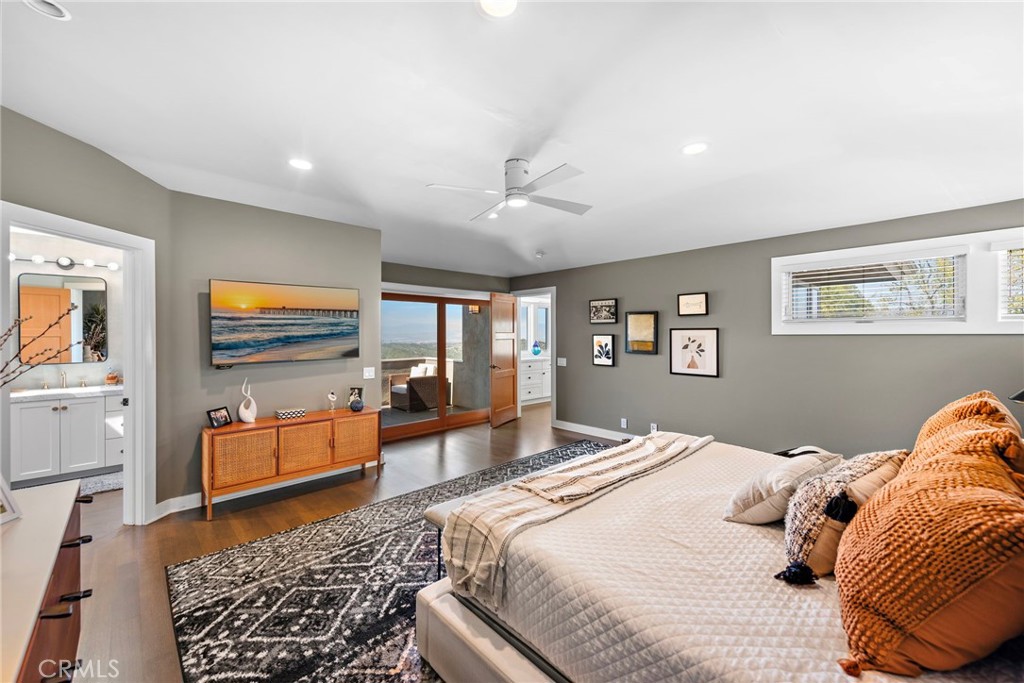 3085 Nestall Road Laguna Beach, CA 92651 - Photo 21 of 33 a bedroom with a bed and wooden floor