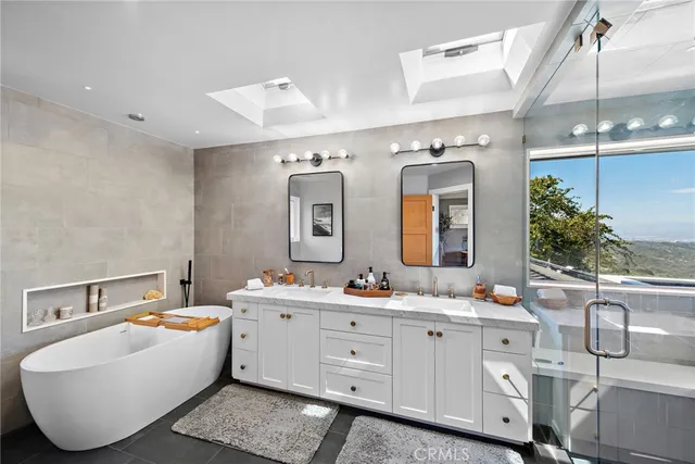 a bathroom with a sink and mirror