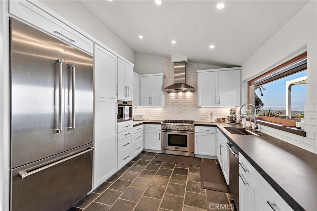 3085 Nestall Road Laguna Beach, CA 92651 - Photo 7 of 33 a kitchen with stainless steel appliances granite countertop a sink stove and refrigerator