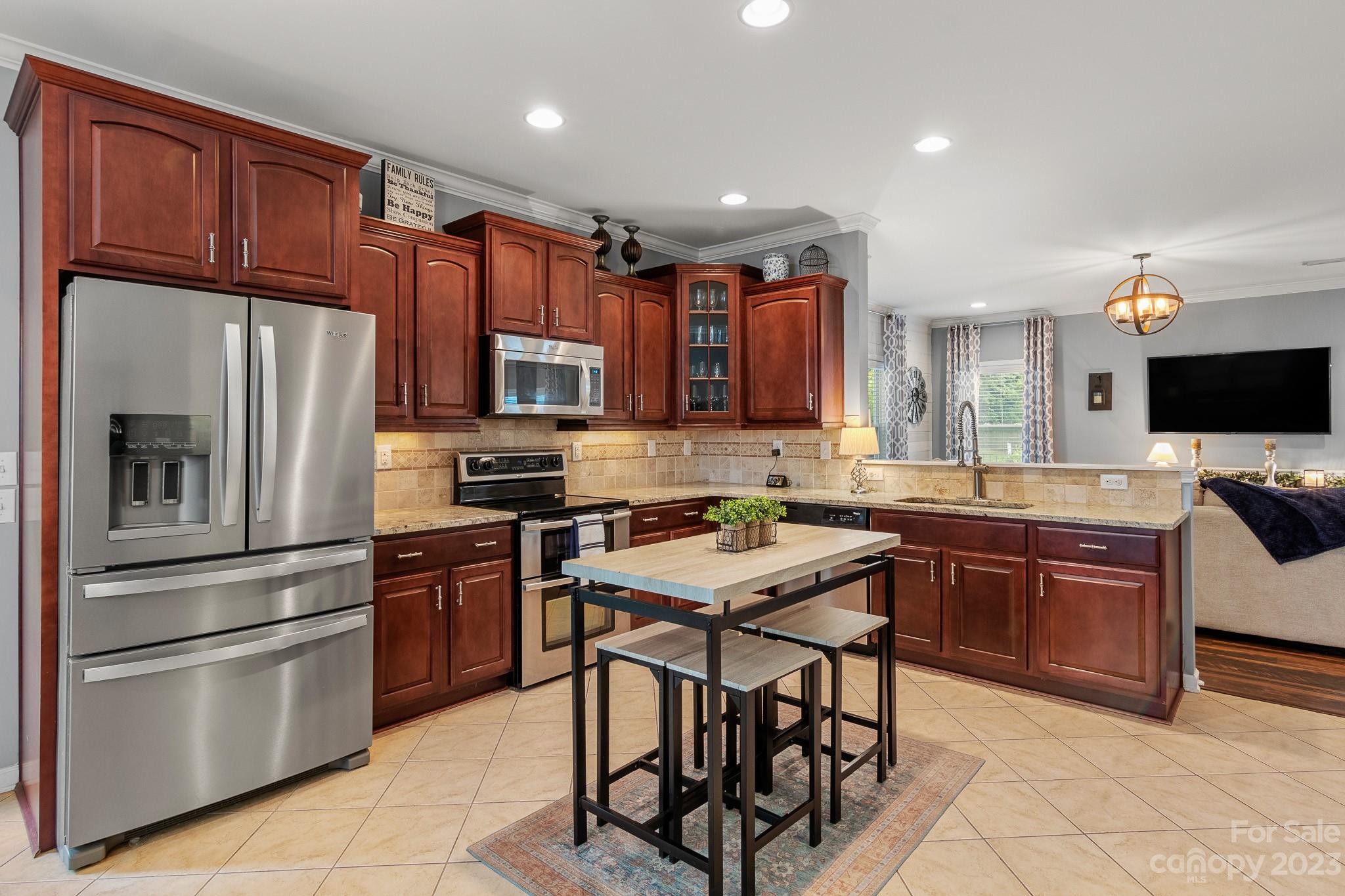 7228 Meyer Road Fort Mill, SC 29715 - Photo 13 of 45 a kitchen with stainless steel appliances granite countertop a refrigerator stove microwave and sink