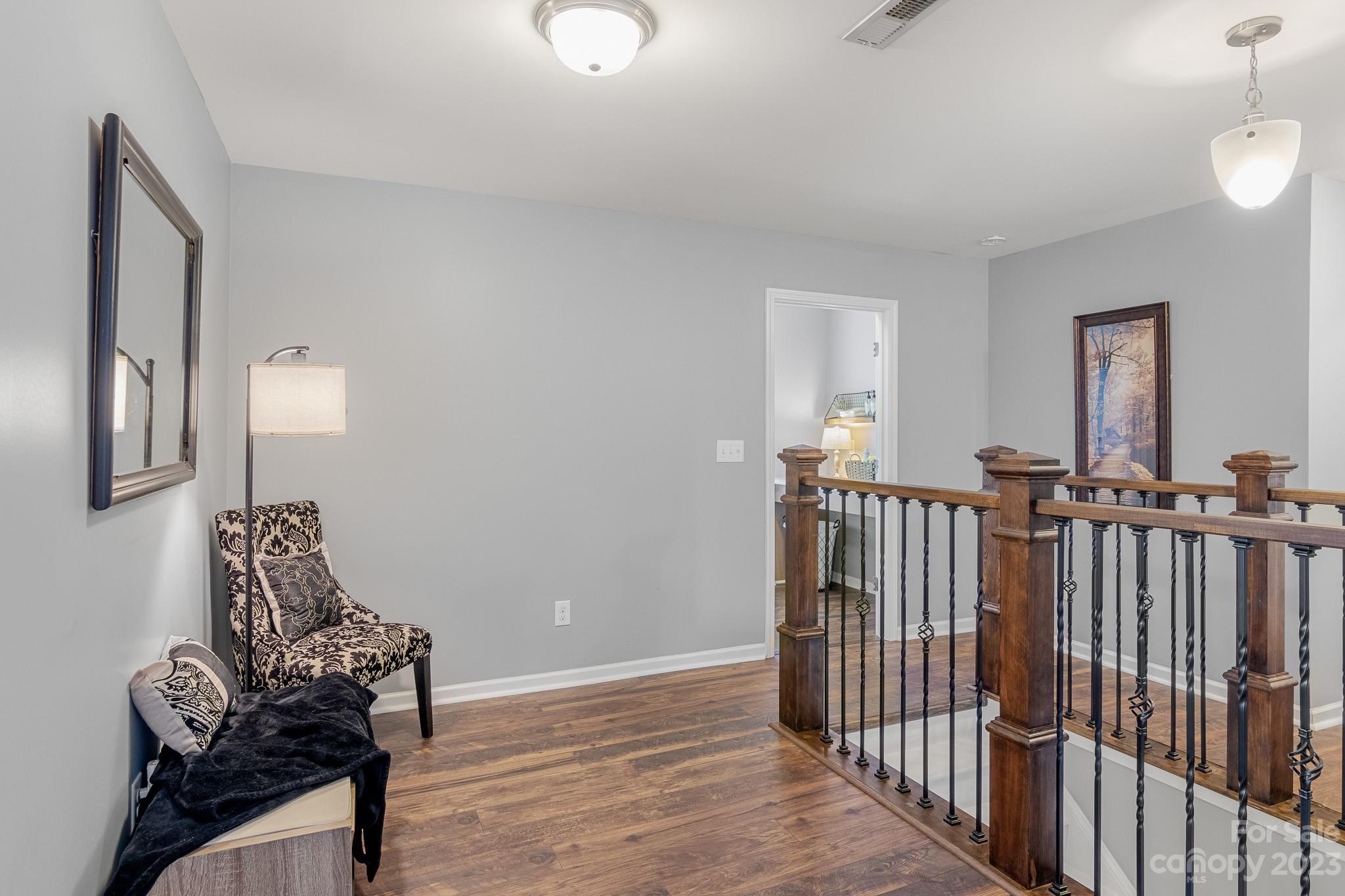 7228 Meyer Road Fort Mill, SC 29715 - Photo 21 of 45 a view of a livingroom with wooden floor and furniture
