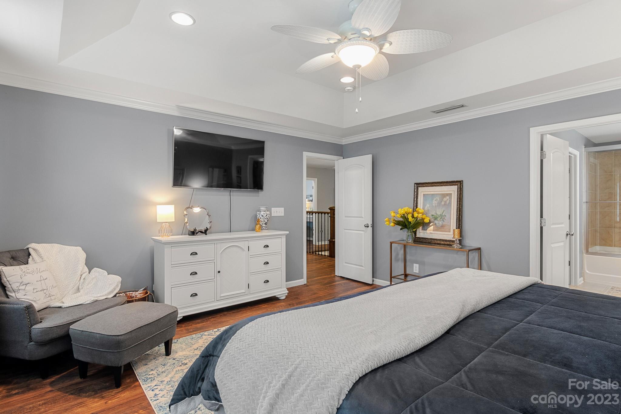 7228 Meyer Road Fort Mill, SC 29715 - Photo 27 of 45 a bedroom with a bed and a flat screen tv