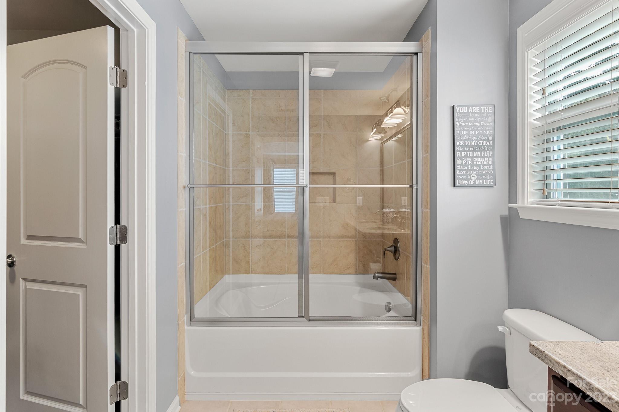7228 Meyer Road Fort Mill, SC 29715 - Photo 29 of 45 a bathroom with a bathtub and toilet