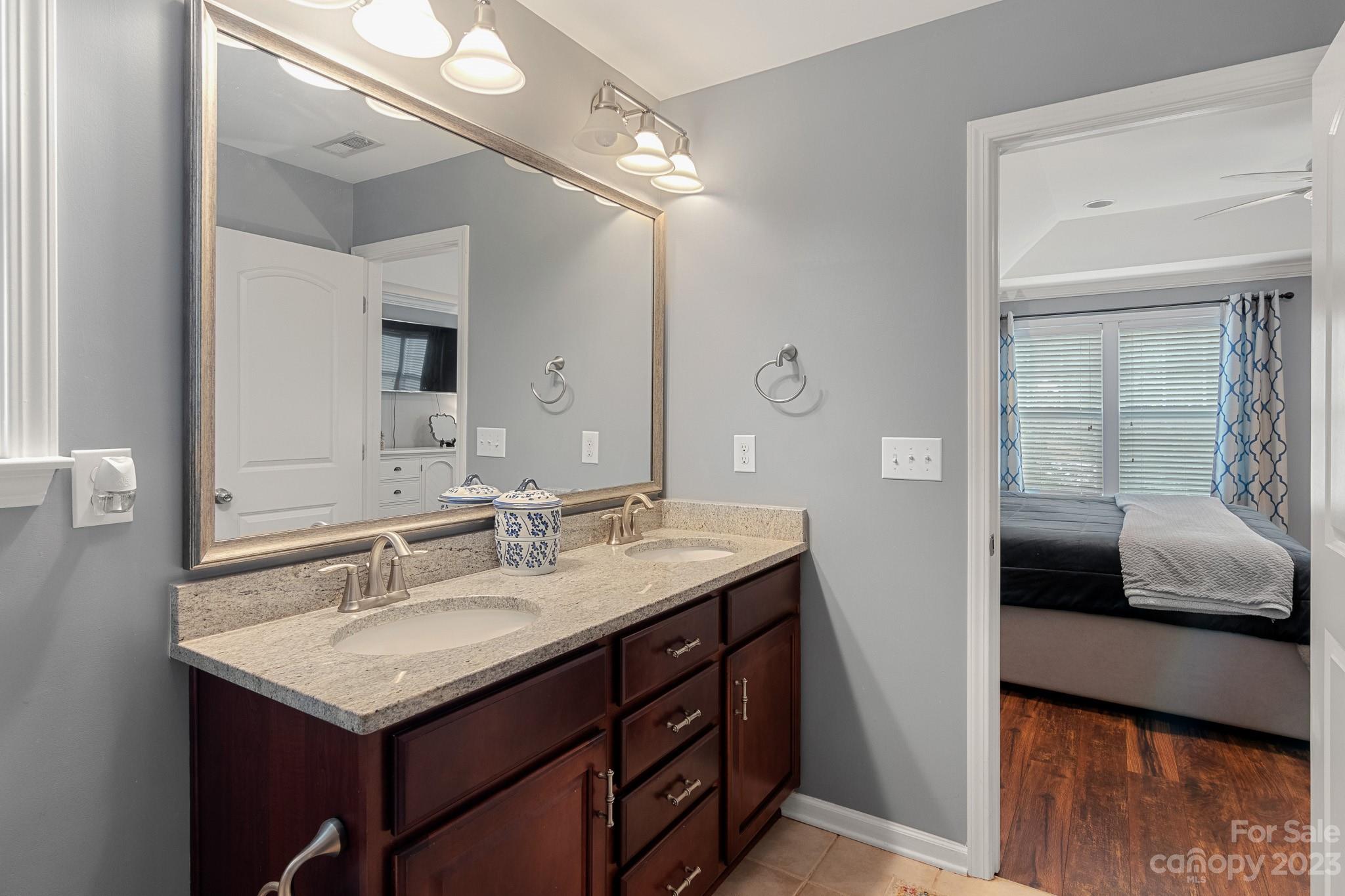 7228 Meyer Road Fort Mill, SC 29715 - Photo 30 of 45 a bathroom with a sink double vanity and a mirror