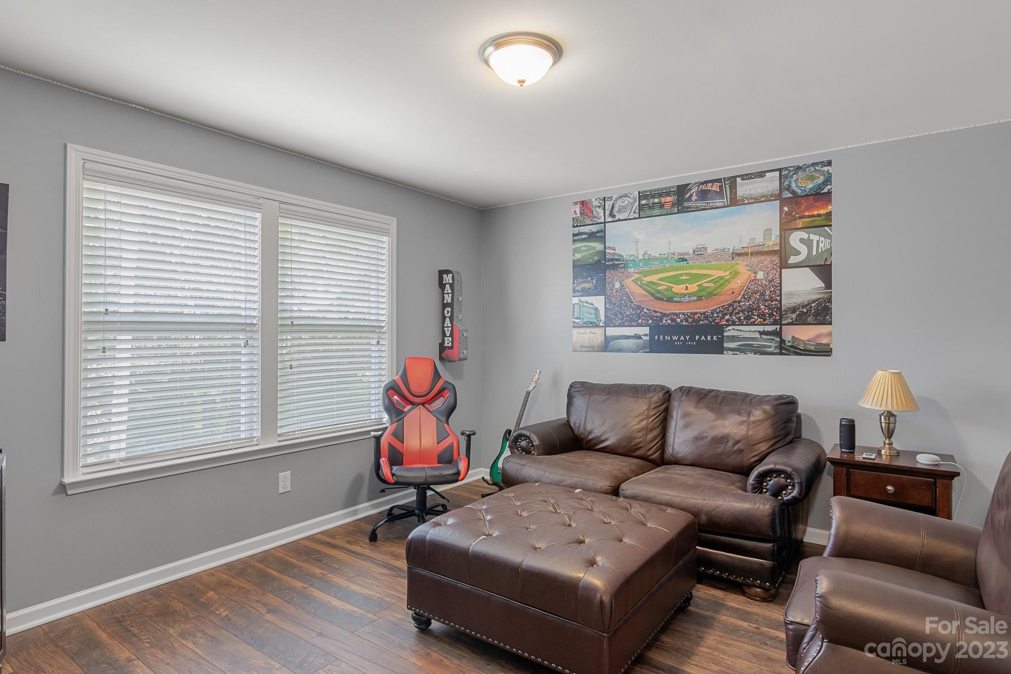 7228 Meyer Road Fort Mill, SC 29715 - Photo 39 of 45 a living room with furniture and painting on the wall