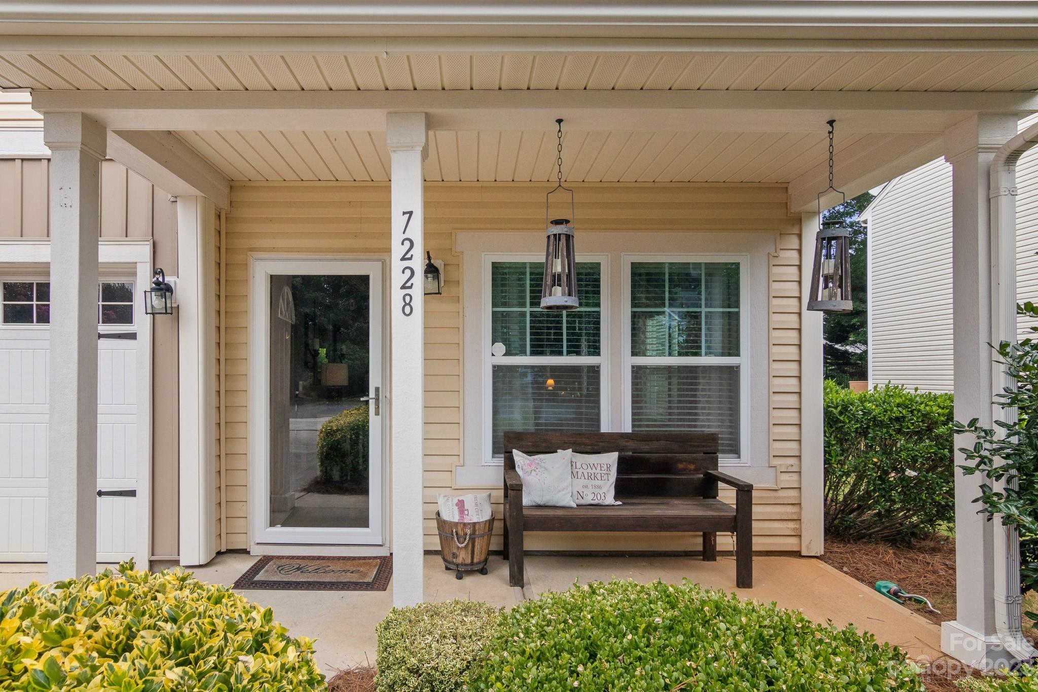 7228 Meyer Road Fort Mill, SC 29715 - Photo 4 of 45 a view of a patio with table and chairs and potted plants