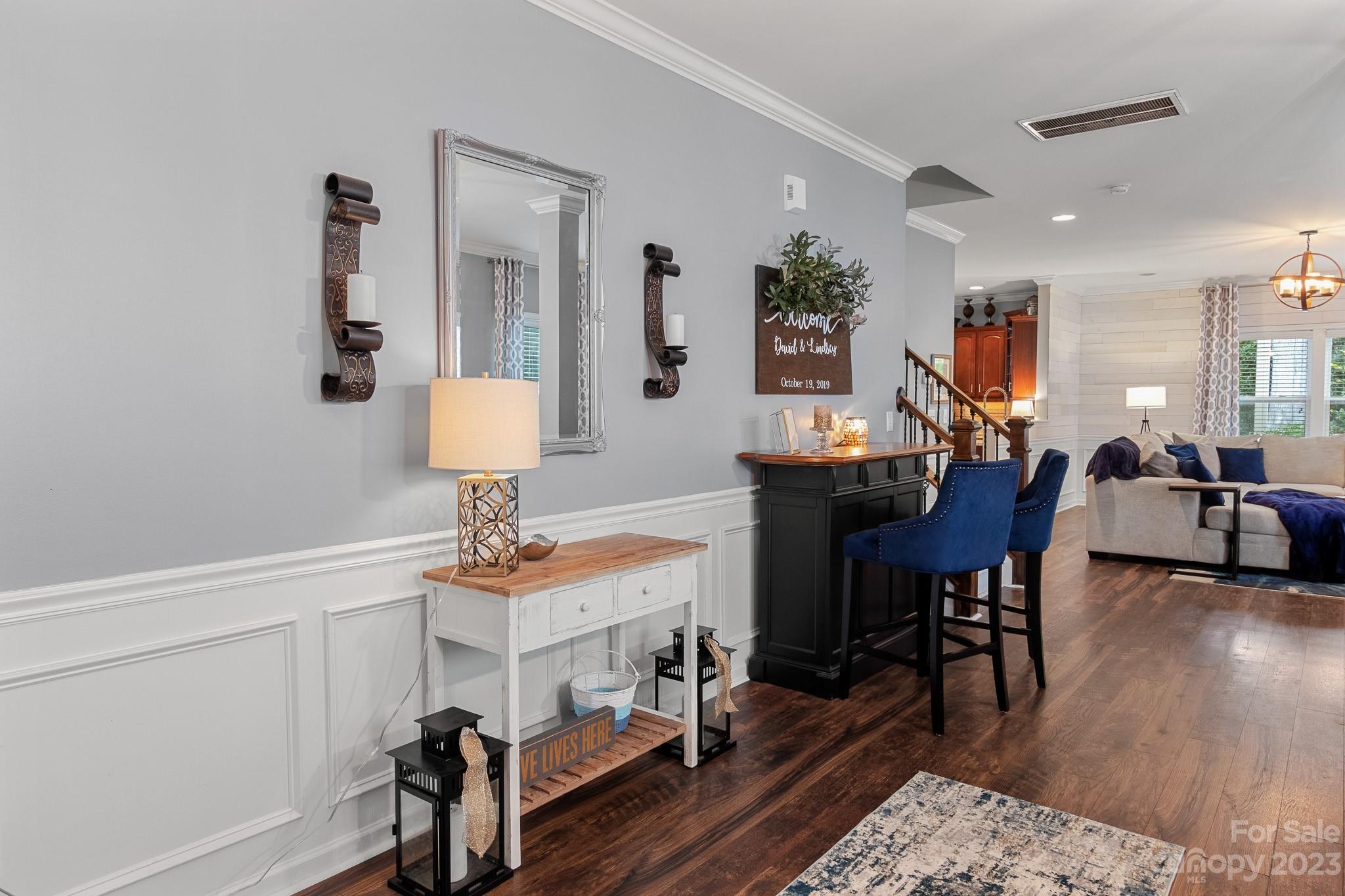 7228 Meyer Road Fort Mill, SC 29715 - Photo 7 of 45 a view of a dining room with furniture and wooden floor