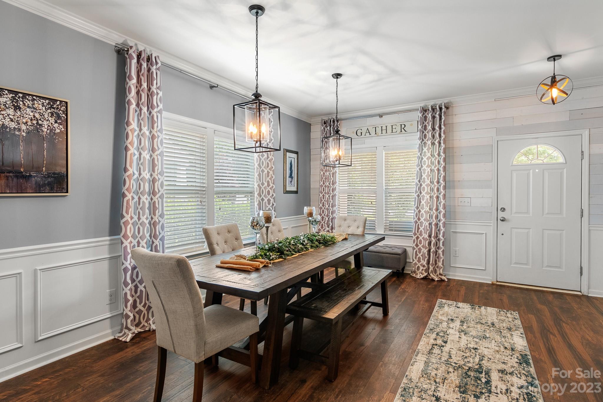 7228 Meyer Road Fort Mill, SC 29715 - Photo 8 of 45 a view of a dining room with furniture window and wooden floor