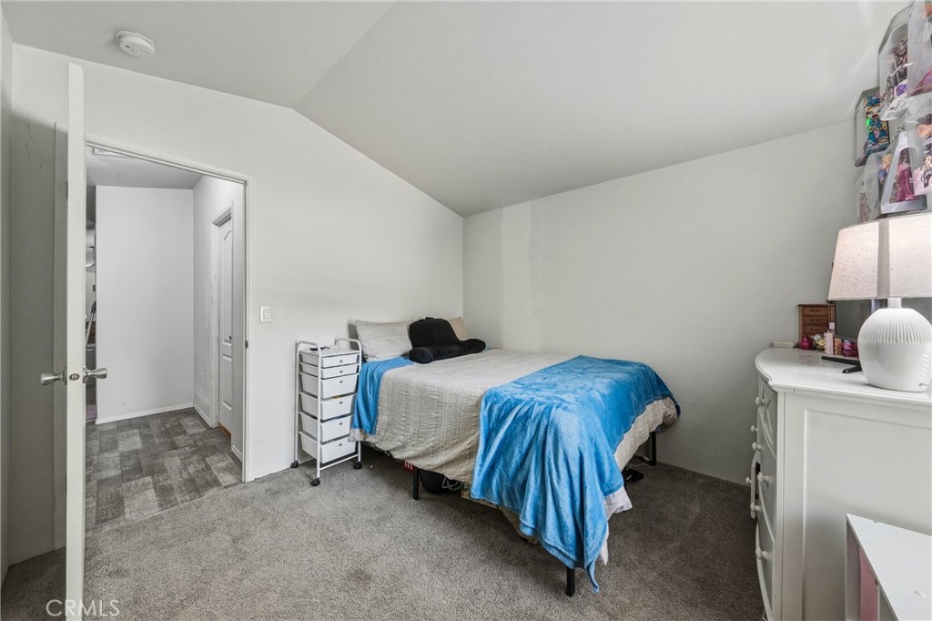 6219 Roland Drive Lucerne, CA 95458 - Photo 15 of 29 a bedroom with a bed and a lamp
