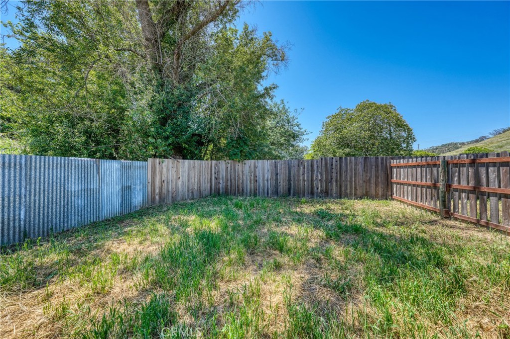 6219 Roland Drive Lucerne, CA 95458 - Photo 19 of 29 a view of a backyard with wooden fence