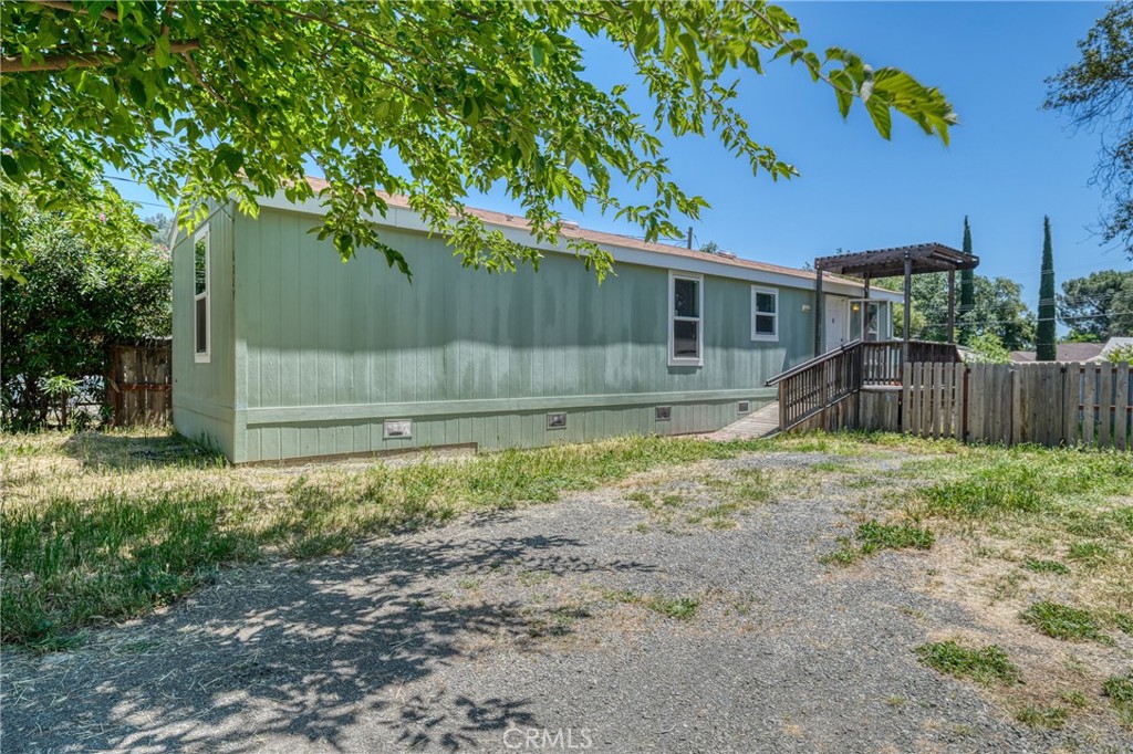 6219 Roland Drive Lucerne, CA 95458 - Photo 20 of 29 a view of a backyard with a small cabin and a chair