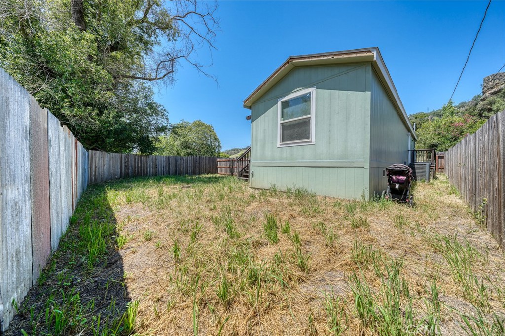 6219 Roland Drive Lucerne, CA 95458 - Photo 21 of 29 a front view of a house with garden