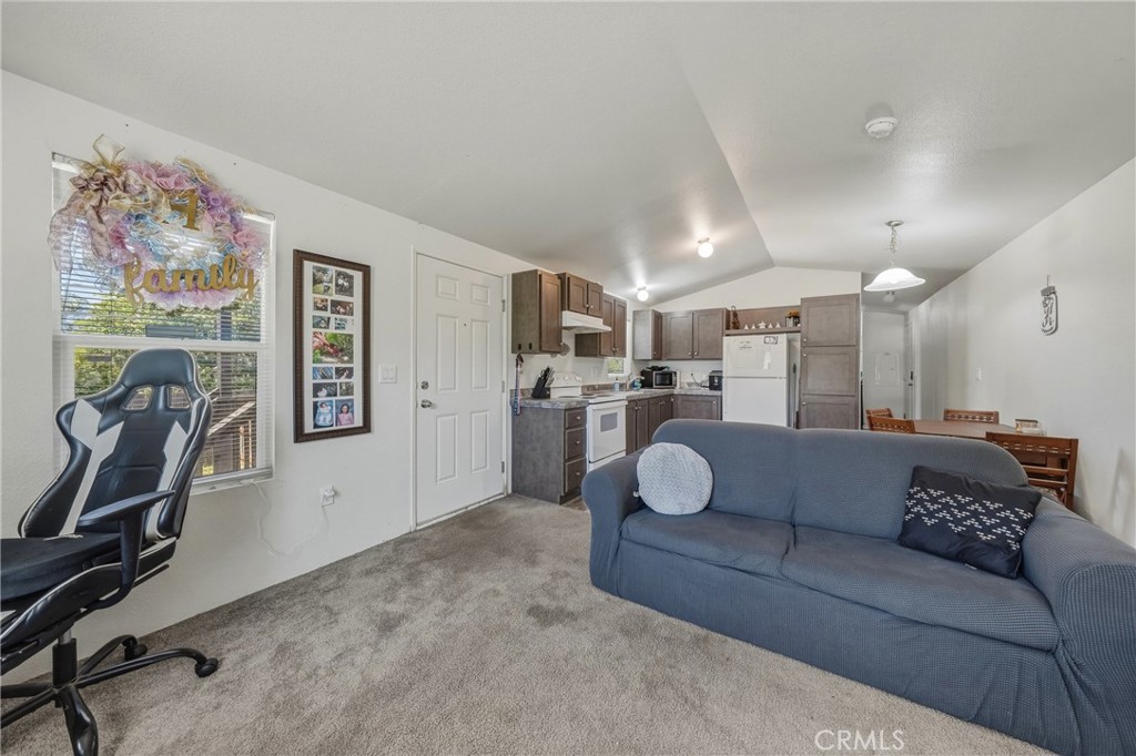 6219 Roland Drive Lucerne, CA 95458 - Photo 8 of 29 a living room with furniture and a flat screen tv