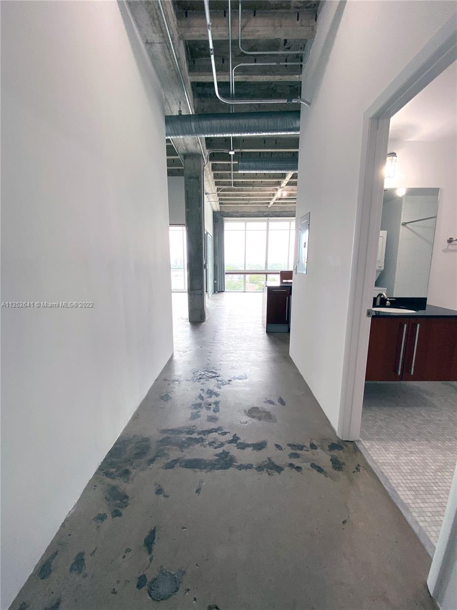 8101 Biscayne Boulevard, Unit R616 Miami, FL 33138 - Photo 1 of 31 a view of a hallway with wooden floor
