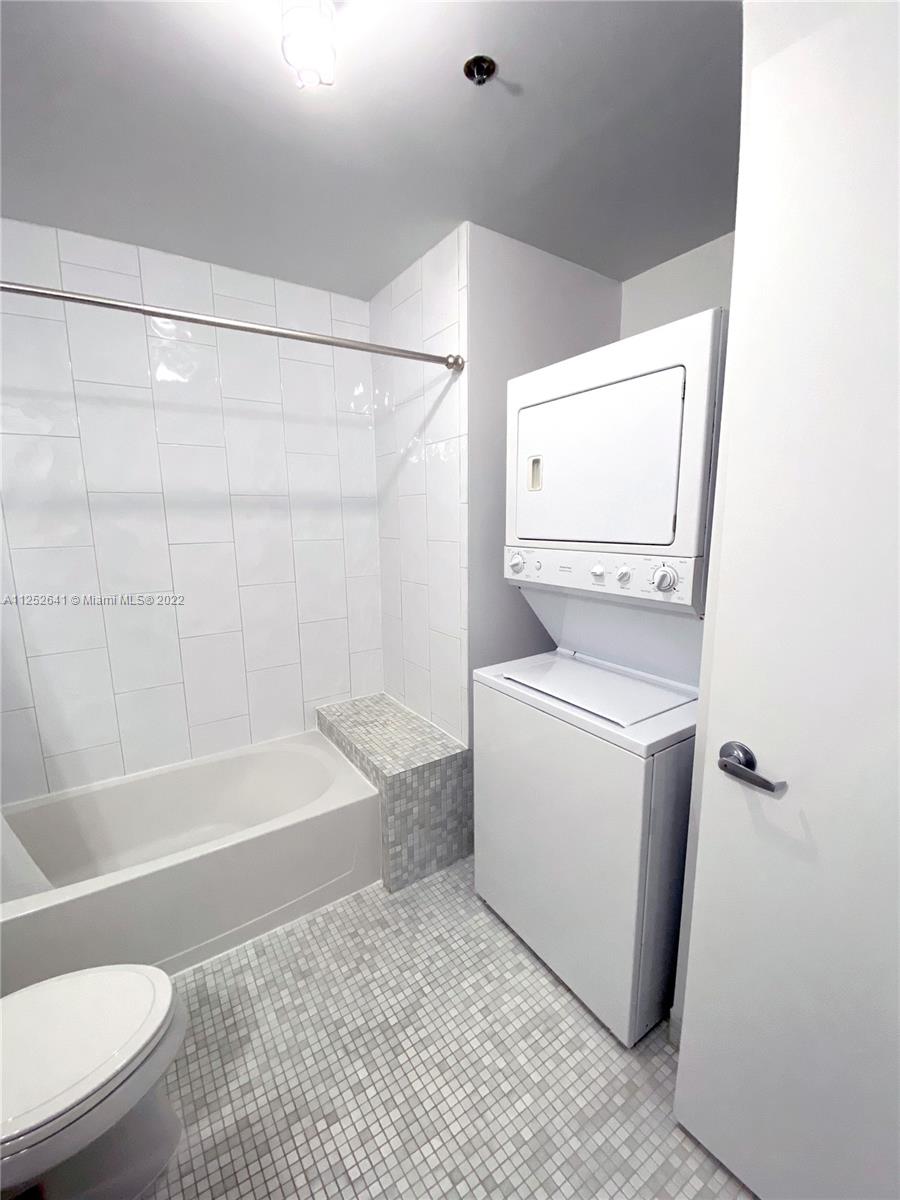 8101 Biscayne Boulevard, Unit R616 Miami, FL 33138 - Photo 3 of 31 a bathroom with a sink a toilet and bathtub