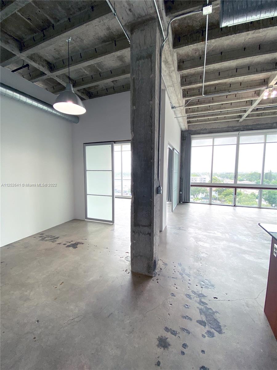 8101 Biscayne Boulevard, Unit R616 Miami, FL 33138 - Photo 4 of 31 a view of empty room with windows