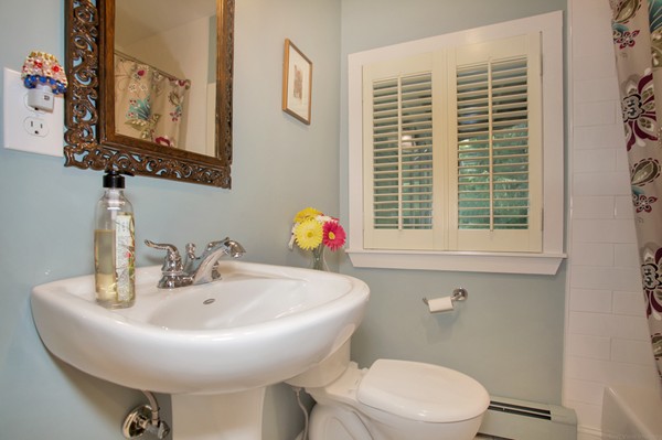 18 Pine Brook Road Wayland, MA 01778 - Photo 12 of 20 a bathroom with a toilet sink and mirror