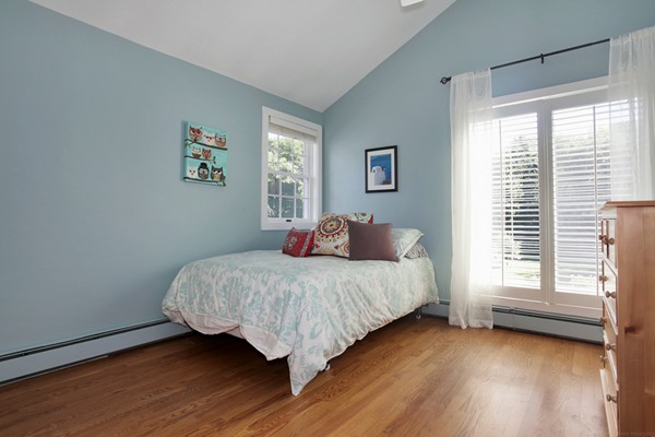 18 Pine Brook Road Wayland, MA 01778 - Photo 17 of 20 a bedroom with a bed and a window