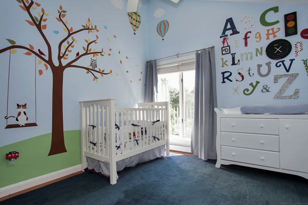 18 Pine Brook Road Wayland, MA 01778 - Photo 18 of 20 a view of a room with baby crib and dresser