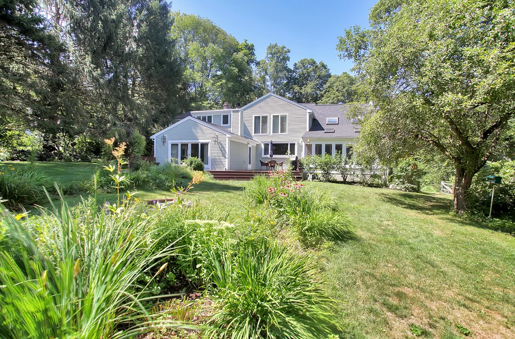 18 Pine Brook Road Wayland, MA 01778 - Photo 20 of 20 a front view of a house with a yard