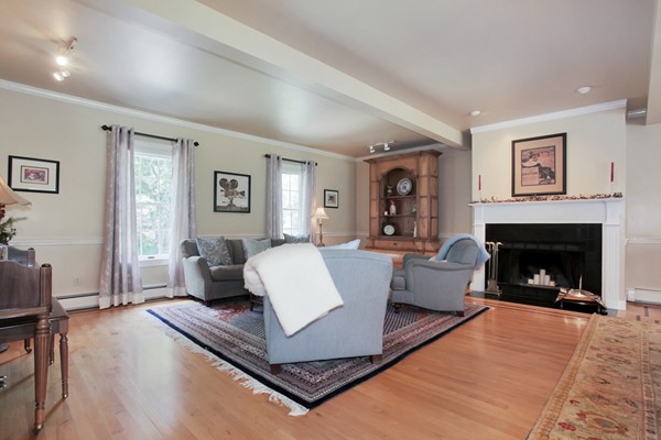 18 Pine Brook Road Wayland, MA 01778 - Photo 5 of 20 a living room with furniture and a fireplace