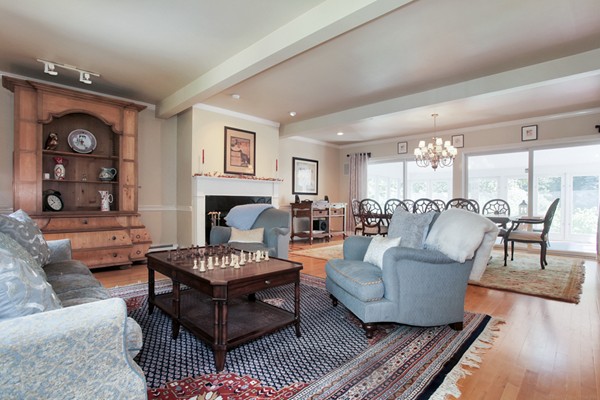 18 Pine Brook Road Wayland, MA 01778 - Photo 6 of 20 a living room with furniture and a fireplace
