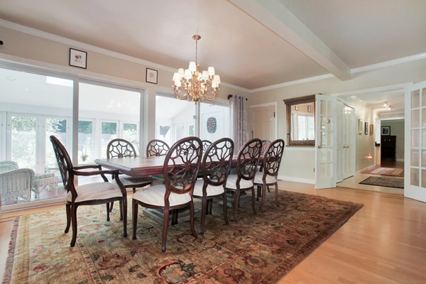 18 Pine Brook Road Wayland, MA 01778 - Photo 8 of 20 a view of a dining room with furniture and chandelier