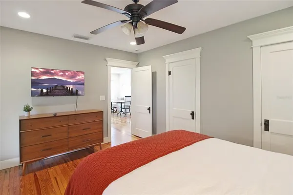 a bedroom with a bed and a dresser