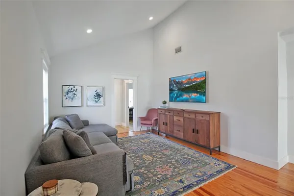 a living room with furniture and a rug