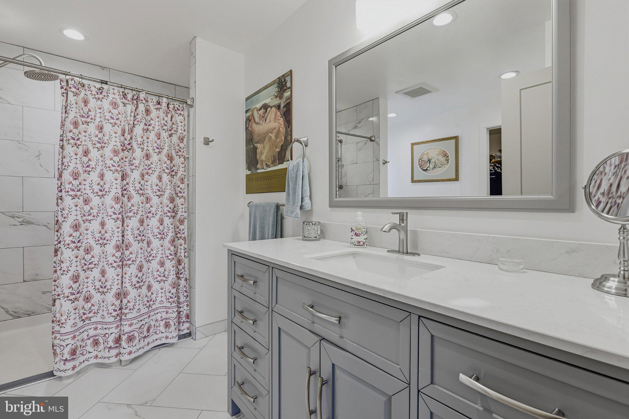 6495 Tides Road King George, VA 22485 - Photo 21 of 65 a bathroom with a sink and a mirror