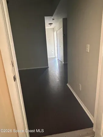 a backyard of a house with lots of green space and lake view