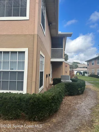 a view of a chandelier fan and wooden floor