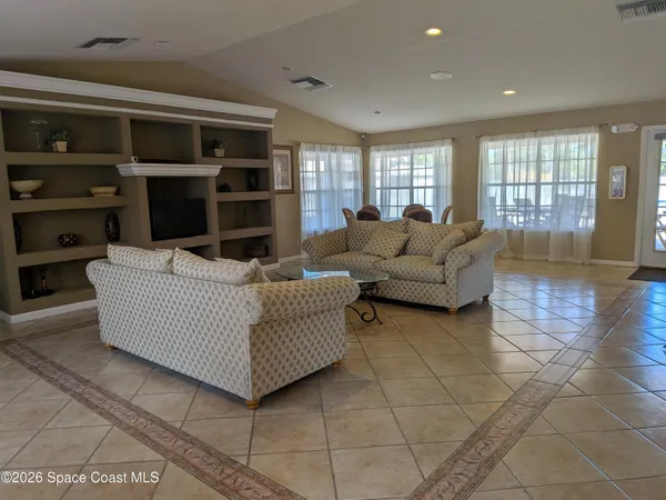 a room with gym equipment and large mirror
