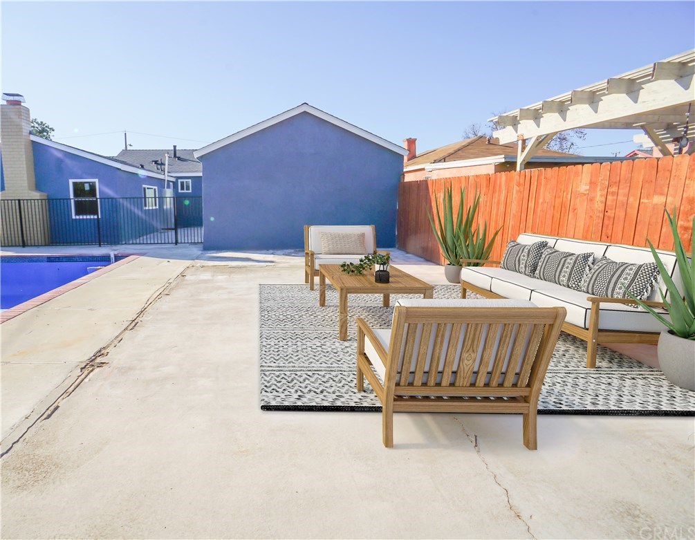 706 North Tajauta Avenue Compton, CA 90220 - Photo 11 of 13 a view of a patio with a table and chairs