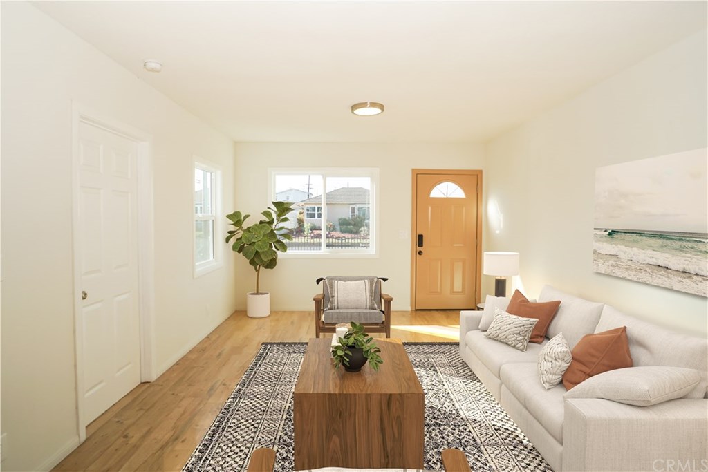 706 North Tajauta Avenue Compton, CA 90220 - Photo 3 of 13 a living room with furniture and wooden floor