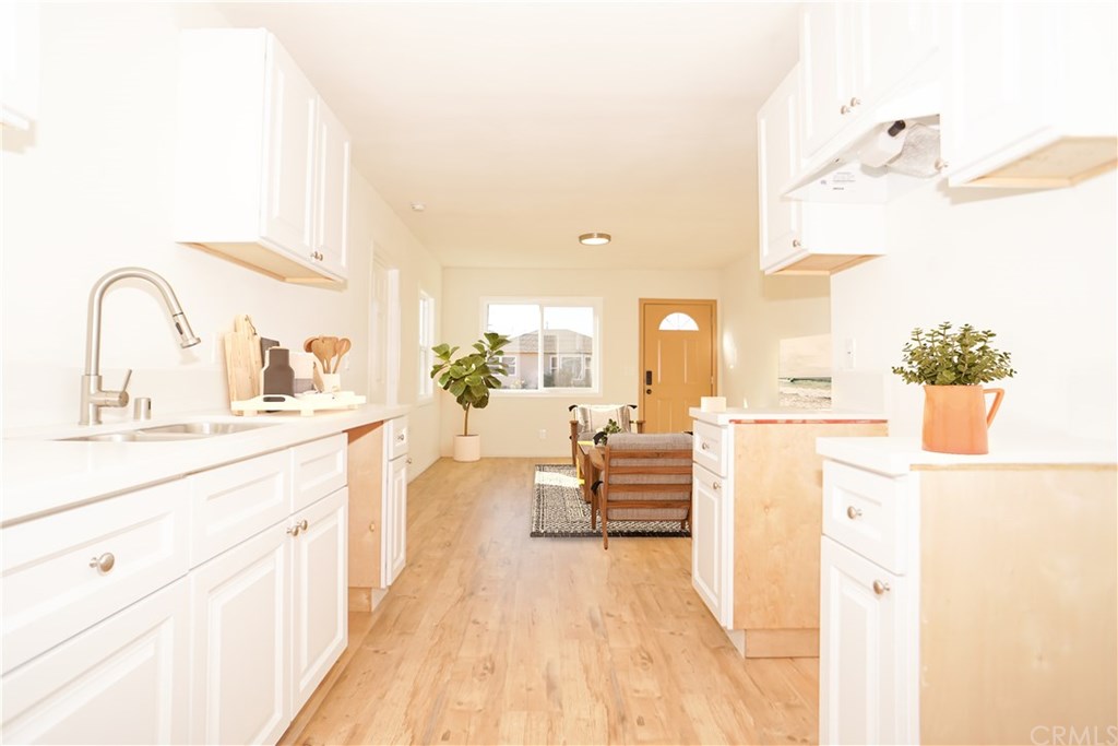 706 North Tajauta Avenue Compton, CA 90220 - Photo 5 of 13 a large white kitchen with a large window