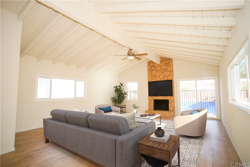 706 North Tajauta Avenue Compton, CA 90220 - Photo 6 of 13 a living room with furniture and a fireplace