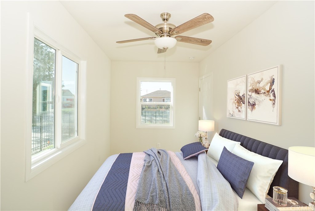 706 North Tajauta Avenue Compton, CA 90220 - Photo 8 of 13 a bed room with a bed and a window