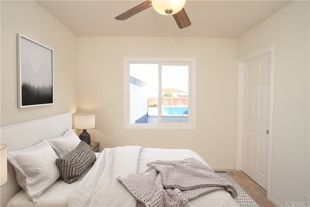 706 North Tajauta Avenue Compton, CA 90220 - Photo 9 of 13 a bedroom with a bed and a window