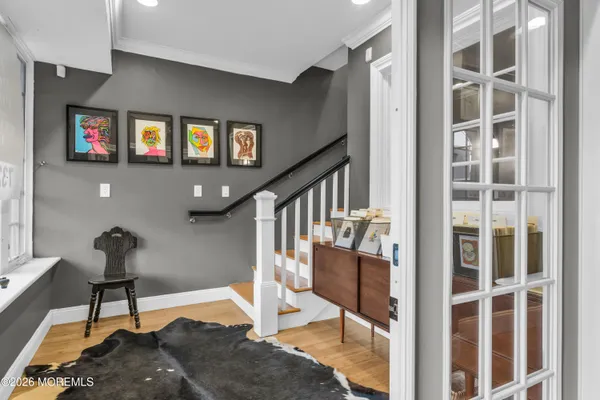 a living room with couch and a book shelf