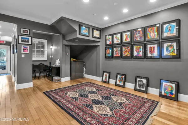 a living room with furniture and a book shelf