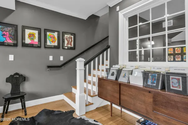 a view of an entryway with wooden floor