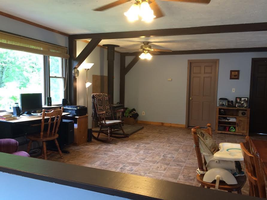606 Battle Ridge Road Clinton, ME 04927 - Photo 7 of 34 Living room with wood stove