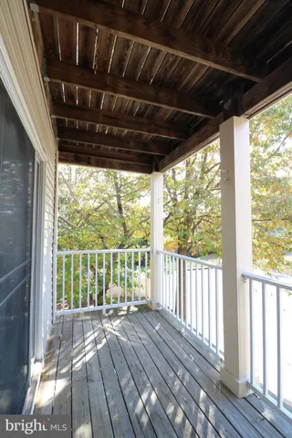a view of porch with wooden floor in outdoor space