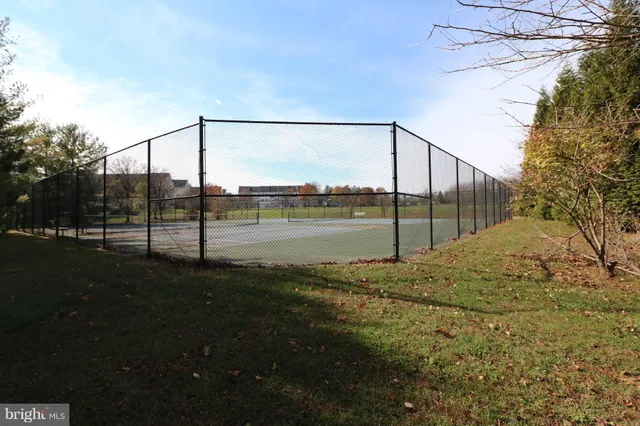 a view of a park with swings and slides